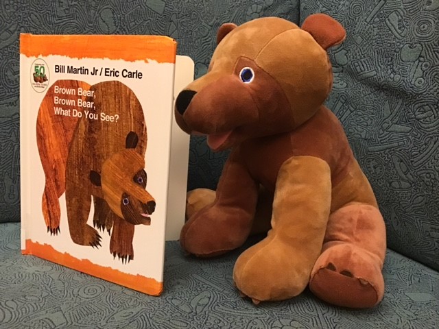 Stuffed Brown Bear looking at book Brown Bear, Brown Bear What Do You See?